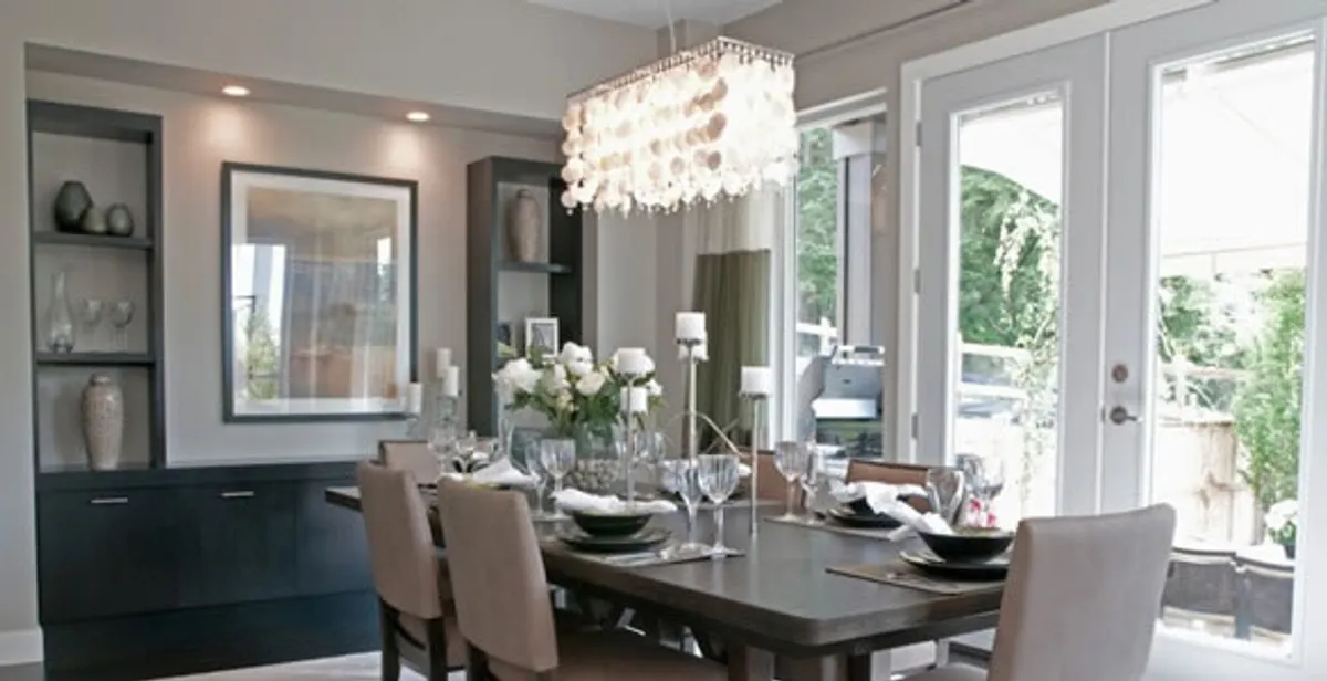 Elegant dining room chandelier installation above table in Charlotte, NC