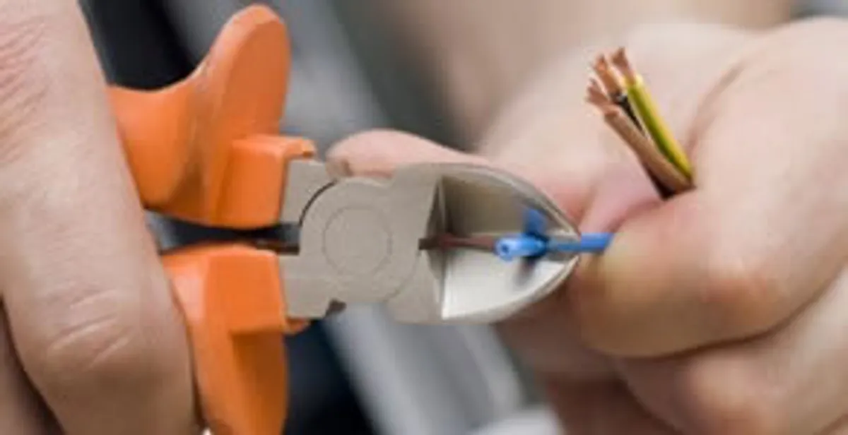 professional electrical services showing precise wire cutting by licensed electricians in Charlotte, NC